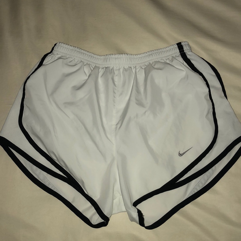 White Nike running shorts